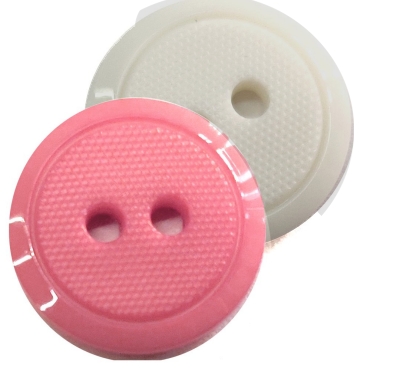 WOMAN BUTTONS COLOURED        2HOLES MILLED W/SMOOTHLY BORD.